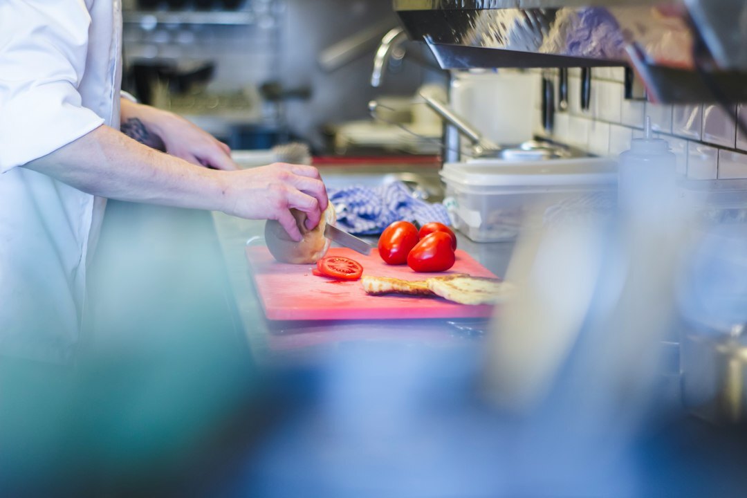 chef preparing meal in kitchen
